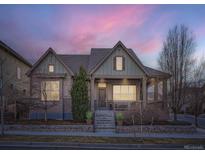 Charming home boasts a covered porch, manicured lawn, and inviting curb appeal with great landscaping at 5590 W 97Th Ave, Westminster, CO 80020