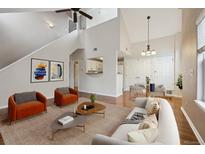Bright living room with modern decor, hardwood floors, and comfortable seating at 14399 E Grand Dr # 150, Aurora, CO 80015