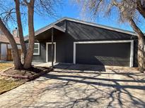Charming single-Gathering home with a two-car garage and mature trees in a suburban neighborhood at 2215 S Oakland Way, Aurora, CO 80014