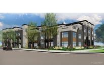 Modern three-story townhome with a mix of gray and brown siding, large windows, and manicured landscaping at 24 Oneida Ct, Denver, CO 80230