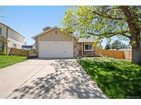 Charming single-Gathering home with a two-car garage, landscaped front yard, and inviting curb appeal at 4860 E 120Th Pl, Thornton, CO 80241