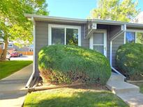 Charming townhome featuring a well-manicured lawn and an inviting front entrance at 5721 W 92Nd Ave # 66, Westminster, CO 80031