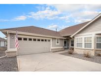 Charming single-story home with a two-car garage, tidy landscaping, and a welcoming front entrance at 7683 S Biloxi Way, Aurora, CO 80016