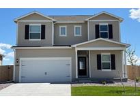 Charming two-story home with a front-facing two car garage, green lawn, and black window shutters at 2204 Alyssa St, Fort Lupton, CO 80621
