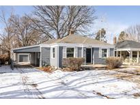 Lovely home with a carport, showcasing its inviting facade and snowy surroundings at 2773 S Franklin St, Denver, CO 80210