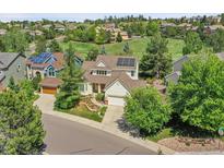 Charming two-story home with a well-maintained lawn and a solar panel, in a Gathering-friendly neighborhood at 848 Huntington Pl, Highlands Ranch, CO 80126