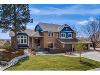 Charming two-story home features a manicured lawn, three car garage and tasteful landscaping at 2162 Terraridge Dr, Highlands Ranch, CO 80126