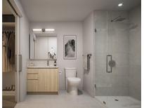 Modern bathroom featuring a glass enclosed shower, wood vanity, and sleek fixtures at 525 18Th St # 1210, Denver, CO 80202