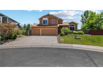 Inviting two-story home featuring a well-maintained lawn and a spacious two-car garage at 3968 Ashcroft Ave, Castle Rock, CO 80104