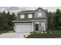 Charming two-story home with a well-manicured lawn, lovely landscaping and an attached two-car garage at 2145 Flower Blossom Ave, Brighton, CO 80601