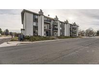 Front view of a multi-unit residential building with parking at 2280 S Oswego Way # 104, Aurora, CO 80014