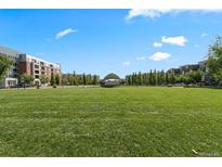 Expansive green space and outdoor amphitheater offer a vibrant community gathering spot at 7700 E 29Th Ave # 404, Denver, CO 80238