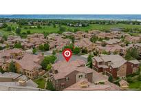 An aerial view shows the community and landscaping at 9228 Sori Ln, Highlands Ranch, CO 80126
