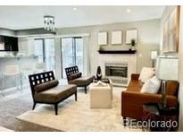 Bright living room features a fireplace and sliding glass doors at 9680 Brentwood Way # 203, Broomfield, CO 80021