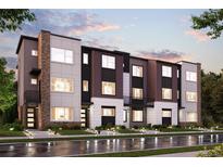 Modern three-story townhomes with brick and panel siding at 461 Interlocken Blvd # 102, Broomfield, CO 80021