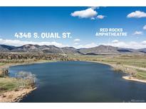 Scenic aerial view of 4346 S. Quail St. near Red Rocks Amphitheatre and a tranquil lake at 4346 S Quail St, Littleton, CO 80127