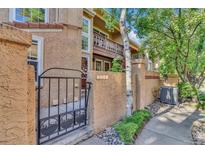 Charming home exterior with gated entrance and well-maintained landscaping at 8747 Mesquite Row, Lone Tree, CO 80124