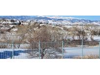 Beautiful mountain view overlooking a snow-covered landscape and community with distant trees at 8627 Gold Peak Pl # C, Highlands Ranch, CO 80130
