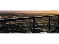 Stunning city view showcasing the skyline and mountains from a high rise balcony with black railings at 1133 14Th St # 3430, Denver, CO 80202