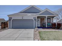 Charming single-Gathering home with a two-car garage, covered porch, and well-maintained landscaping at 4361 Kirk Ct, Denver, CO 80249