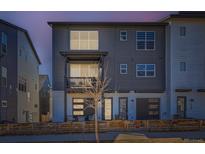 Charming, modern two-story home with eye-catching curb appeal and a small, cozy balcony at 2052 Alcott Way, Broomfield, CO 80023