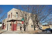 Two-story home featuring a flat roof, stucco siding, with street and neighborhood views at 3700-3704 Osage St, Denver, CO 80211