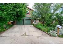 Charming two-story home with a lush front yard and attached two car garage at 3982 Arbol Ct, Boulder, CO 80301