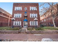 Attractive brick apartment building with landscaping and well-maintained grounds at 1341 N Washington St # 4, Denver, CO 80203