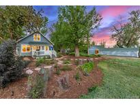 Charming home with well-maintained landscaping, flowerbeds, and a welcoming front porch at 13183 N 95Th St, Longmont, CO 80504