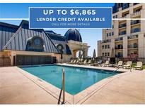 Inviting pool area with ample seating and well-maintained landscaping at this luxurious community at 925 N Lincoln St # 8E-S, Denver, CO 80203