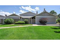 Front view of a charming ranch style home with well-manicured lawn at 10321 E Evans Se Ave # 176, Aurora, CO 80247