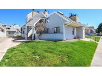 Charming condo with well-maintained lawn and appealing exterior in a sunny neighborhood at 17003 E Tennessee Dr # 209, Aurora, CO 80017