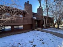 Two-story brown townhouse with a small balcony and chimneys visible on a sunny day with snow on the ground at 2630 Juniper Ave # 37-6, Boulder, CO 80304