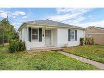 Charming home featuring white exterior and well-maintained lawn at 3715 N Jackson St, Denver, CO 80205