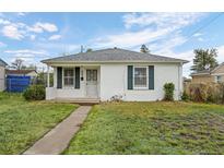 Charming home featuring white exterior and well-maintained lawn at 3715 N Jackson St, Denver, CO 80205