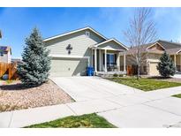 Charming single-Gathering home with an attached garage and a well-manicured front yard at 541 Park Blvd, Brighton, CO 80603