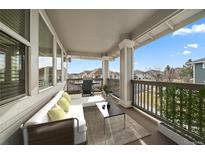 Relaxing outdoor balcony featuring comfortable seating and scenic neighborhood views. Beautiful place to relax! at 74 Whitehaven Cir, Highlands Ranch, CO 80129