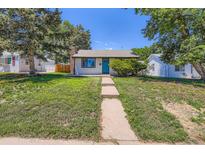 Charming home with a well-manicured lawn, inviting walkway, and a striking blue front door at 2625 S Linley Ct, Denver, CO 80219