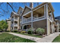Inviting condo exterior featuring multiple balconies, neutral tones, and well-maintained landscaping at 6001 Castlegate Dr # A33, Castle Rock, CO 80108