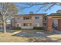 Exterior view of a two-story condo building with landscaping at 770 Copper Ln # 206, Louisville, CO 80027