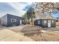 Charming home with a well-maintained yard, showcasing a modern exterior paint and inviting curb appeal at 20 E 45Th Ave, Denver, CO 80216