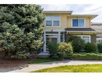 Inviting two-story townhome with lush landscaping and a charming entrance, offering curb appeal at 3000 E 112 Ave # 102, Northglenn, CO 80233