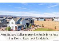 New construction home with a welcoming front yard in a community surrounded by mountain views at 8353 Bijou Creek Ave, Littleton, CO 80125