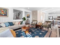 Comfortable living area with stylish decor and an open layout, perfect for entertaining and relaxation at 8353 Bijou Creek Ave, Littleton, CO 80125