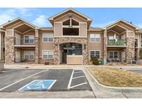 Attractive multi-Gathering home with stone accents, balconies, and accessible parking at 10715 Twenty Mile Rd # 203, Parker, CO 80134