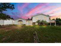 Charming split-level home with a well-maintained lawn and inviting front entrance at 723 Brussels Dr, Parker, CO 80138