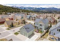 An aerial view of a mountain neighborhood and beautiful home exteriors in a scenic, desirable location at 45 Bridge St, Breckenridge, CO 80424