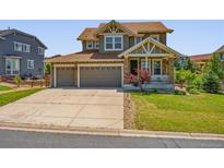 Charming two-story home with a three-car garage and well-maintained front lawn at 42350 Forest Oaks Dr, Elizabeth, CO 80107