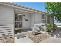 Ranch style home with front porch and security door at 220 S Julian St # C, Denver, CO 80219