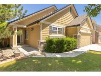 Charming home exterior featuring a well-maintained yard and inviting entrance at 16102 Grebe Pl, Parker, CO 80134